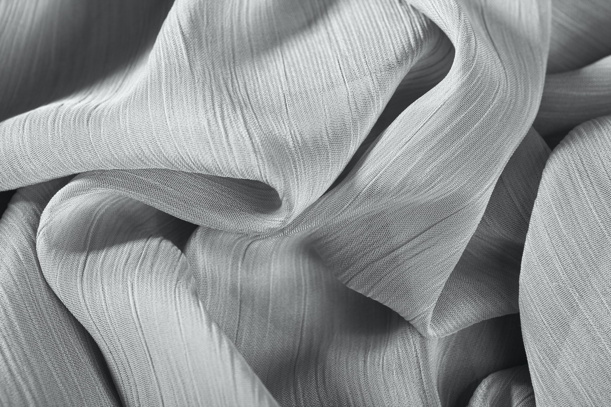 Multiple textile samples overlapping in soft monochrome