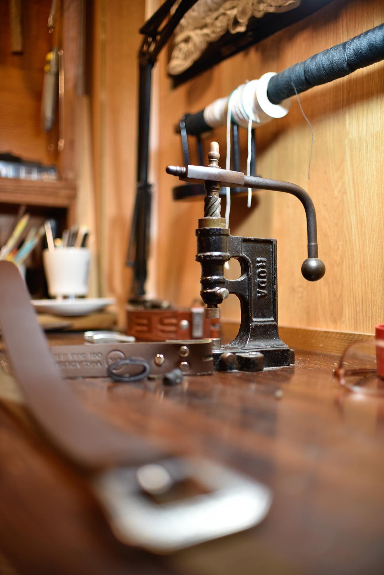 Workshop bench with sewing machine and tools