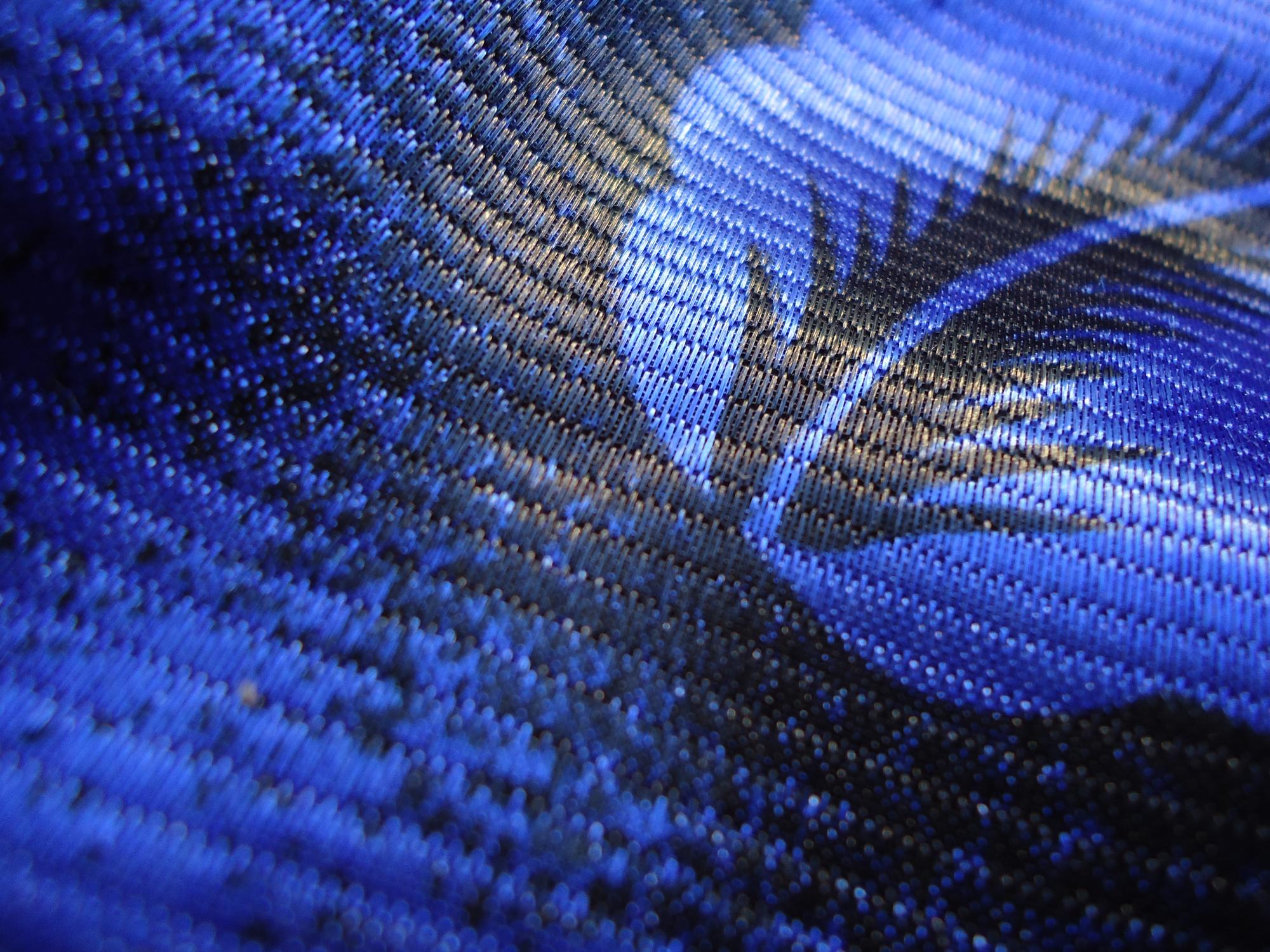 Close-up of embroidered circuit pattern on fabric